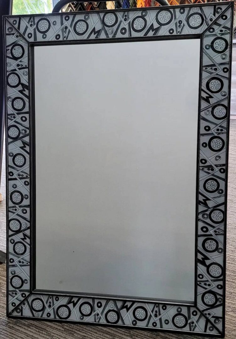 2 A mirror with black and white designs on it