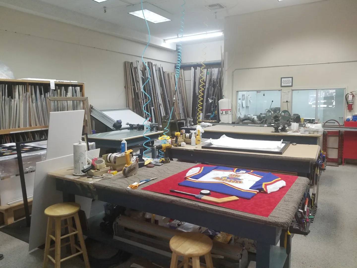 The Frame Shop A room with two tables and chairs in it
