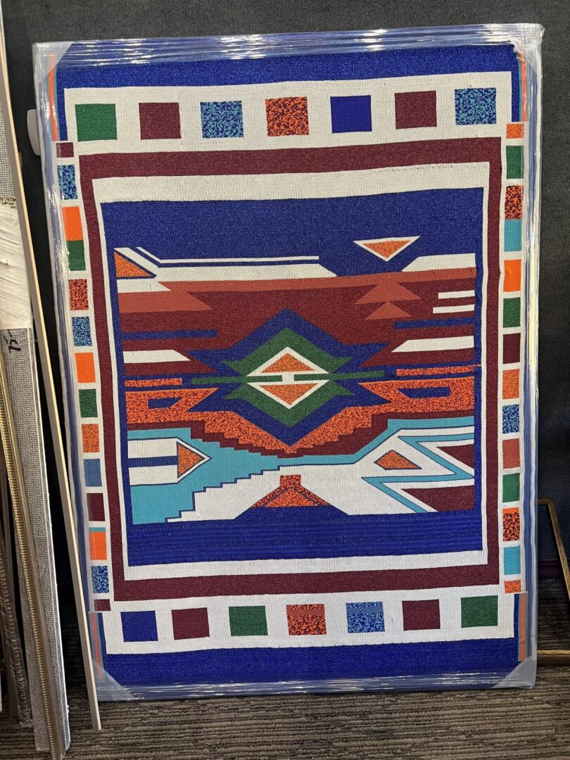 Beadwork A quilt with an abstract design on it.