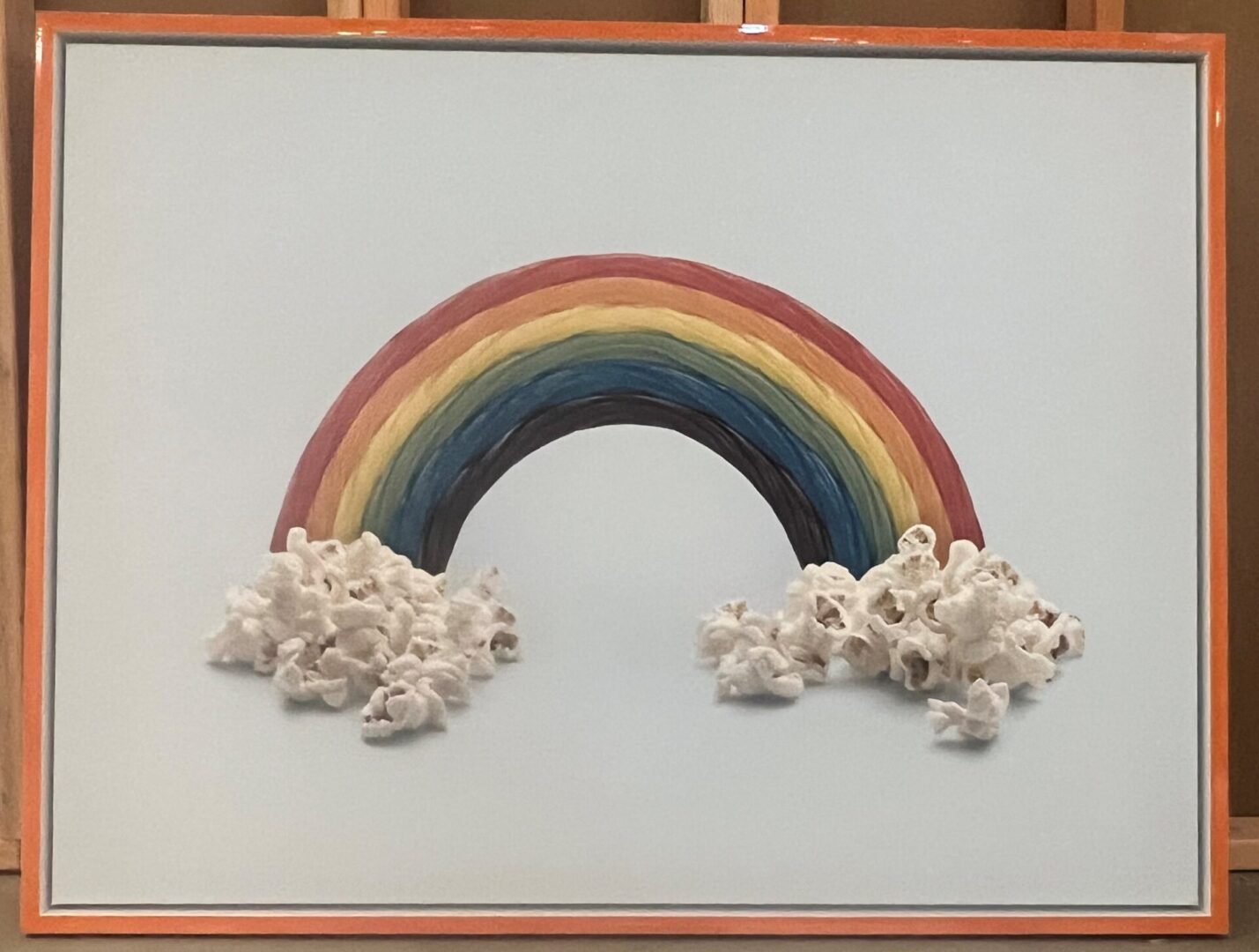 Orange Float 1 A rainbow made out of popcorn and popcorn is on the wall.