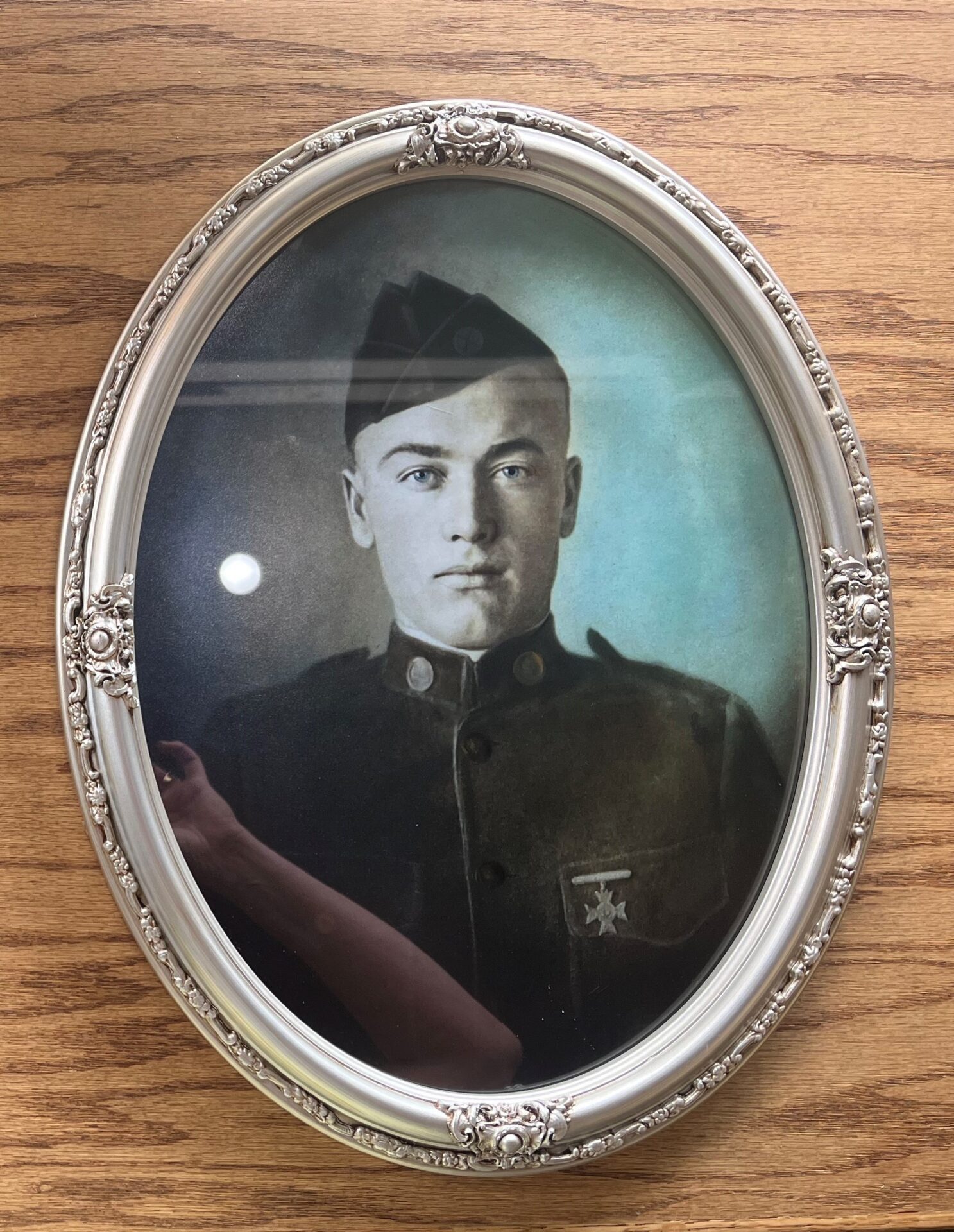 Oval Frame A picture of an old man in uniform.